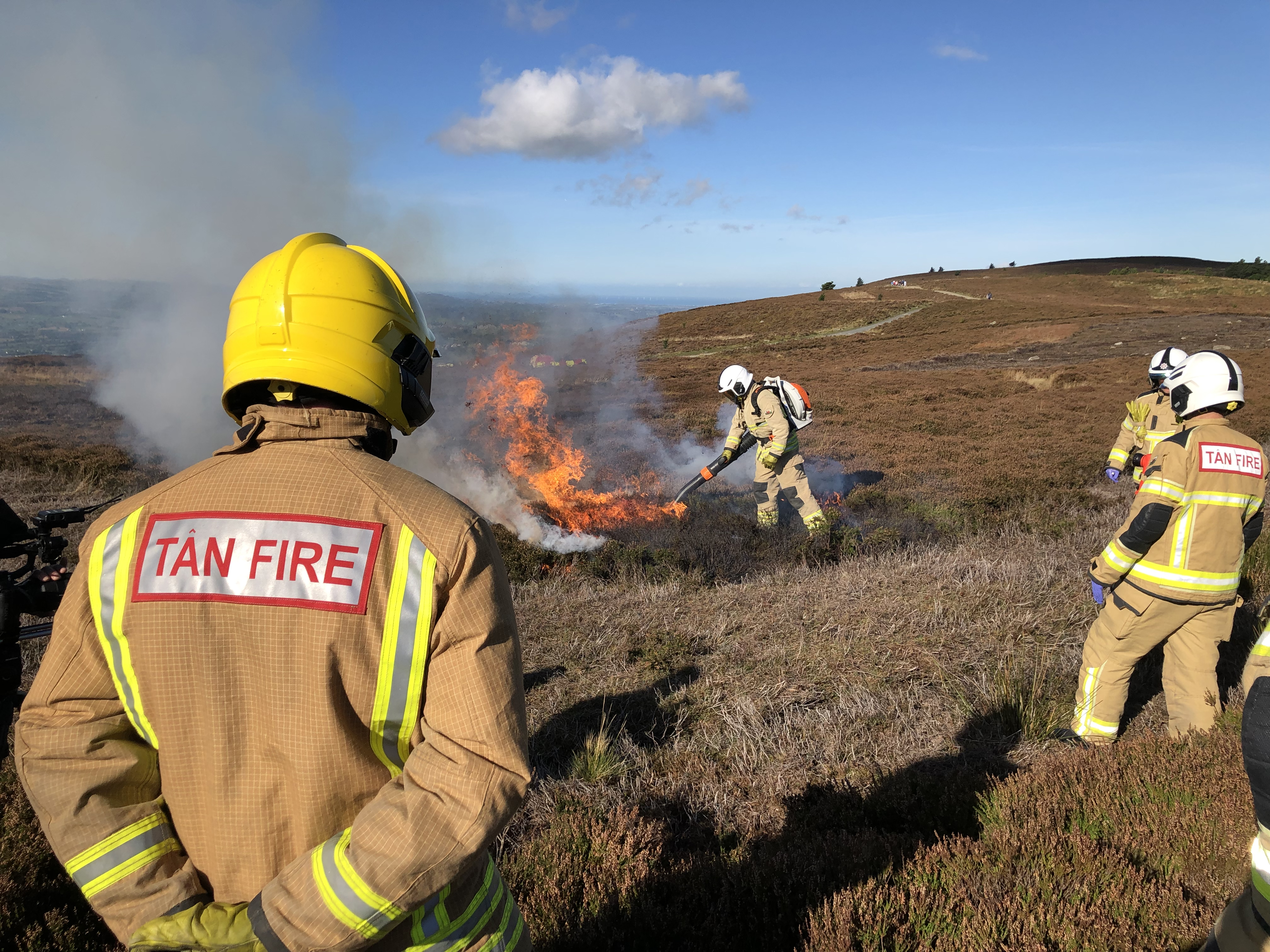 3 firefighters fighting gorse fire