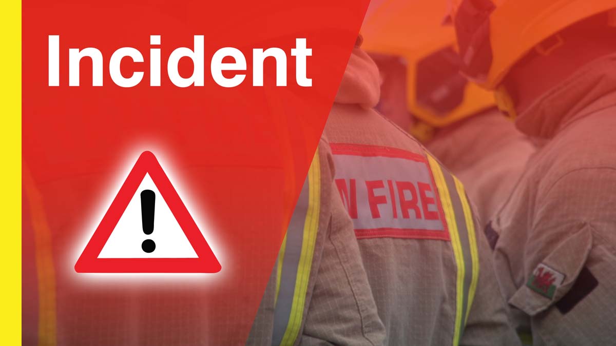 incident image with warning triangle and fire fighters